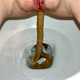 A plump, red-haired girl shits into a toilet in several scenes, naked and in a blue top, with close between-the-legs views of her hairy pussy and the bowl as she pees and pushes out turds. Presented in 720P HD. 93MB, MP4 file. Over 6.5 minutes.